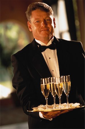 resort service - Portrait of Mature Man in Formal Wear, Holding Tray Stock Photo - Rights-Managed, Code: 700-00061904