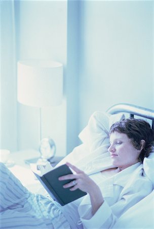 simsearch:700-00062758,k - Woman Lying on Bed Reading Book Stock Photo - Rights-Managed, Code: 700-00062049