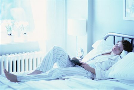 sleeping bed full body - Woman Lying on Bed with Eyes Closed, Holding Book Stock Photo - Rights-Managed, Code: 700-00062051