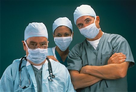 Portrait of Three Surgeons Wearing Surgical Masks Stock Photo - Rights-Managed, Code: 700-00062079