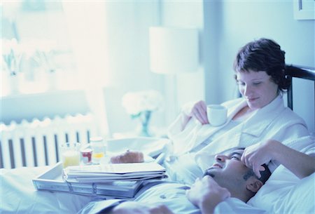 ron fehling bedroom - Couple Relaxing on Bed with Breakfast Tray Stock Photo - Rights-Managed, Code: 700-00062206