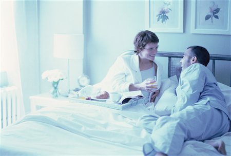 simsearch:700-00062758,k - Couple on Bed with Breakfast Tray Laughing Stock Photo - Rights-Managed, Code: 700-00062207