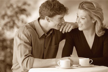 Couple Sitting at Table with Coffee Cups at Cafe Stock Photo - Rights-Managed, Code: 700-00062316