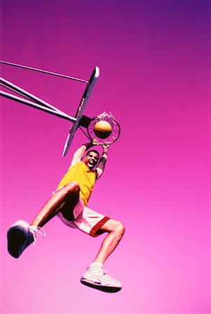 simsearch:700-00032210,k - Man Hanging from Rim of Basketball Net, Yelling Outdoors Stock Photo - Rights-Managed, Code: 700-00062409