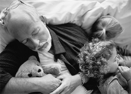 Grandfather and Granddaughters Lying on Sofa, Sleeping Stock Photo - Rights-Managed, Code: 700-00062474