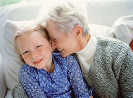 simsearch:700-00046921,k - Grandmother and Granddaughter Sitting on Sofa, Smiling Stock Photo - Rights-Managed, Code: 700-00062503