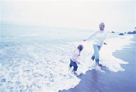 simsearch:700-00062714,k - Grandmother and Granddaughter Standing in Surf on Beach Stock Photo - Rights-Managed, Code: 700-00062709