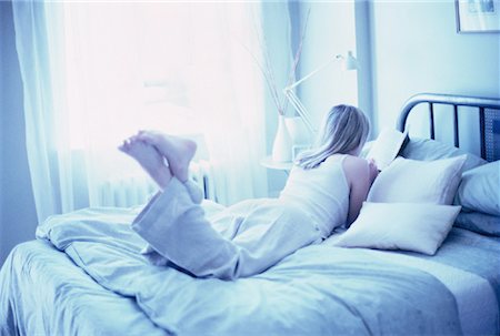 simsearch:700-00062758,k - Back View of Woman Lying on Bed Reading Book Stock Photo - Rights-Managed, Code: 700-00062754