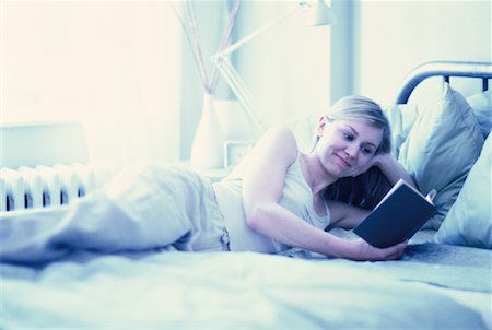 simsearch:700-00062758,k - Woman Lying on Bed, Reading Book Stock Photo - Rights-Managed, Code: 700-00062753