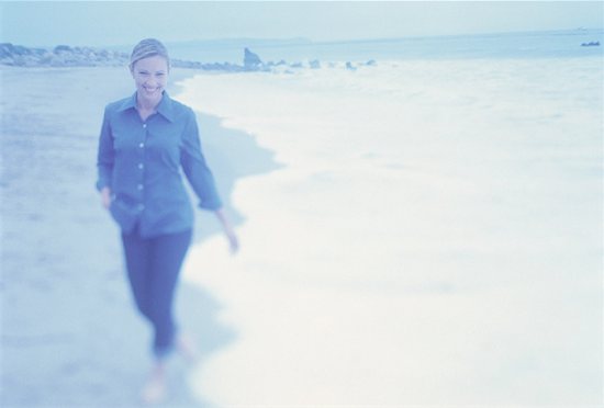 Portrait of Woman Walking in Surf On Beach Stock Photo - Premium Rights-Managed, Artist: Peter Griffith, Image code: 700-00062913