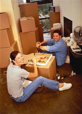 pizza couple - Couple Eating Pizza over Cardboard Box in New Home Stock Photo - Rights-Managed, Code: 700-00063095