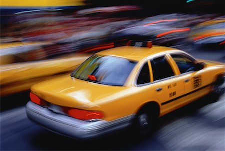 Taxi and Blurred Traffic on City Street, New York, New York, USA Stock Photo - Rights-Managed, Code: 700-00063111
