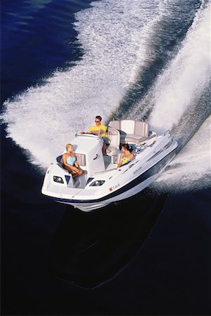simsearch:700-00768094,k - Gens en bateau, excès de vitesse sur l'eau, Florida, USA Photographie de stock - Rights-Managed, Code: 700-00063793