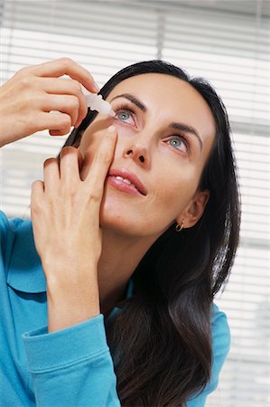 eye drops with eye dropper - Woman Using Eyedrops Stock Photo - Rights-Managed, Code: 700-00074528