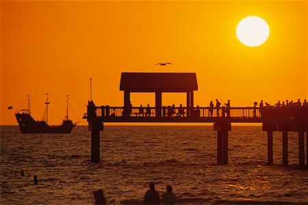 simsearch:700-00186828,k - Silhouette of People on Pier and Ship at Sunset Florida, USA Stock Photo - Rights-Managed, Code: 700-00074848