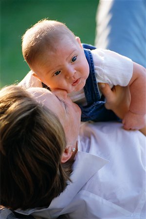 simsearch:700-00178962,k - Mother Lying on Ground, Holding Baby Outdoors Fotografie stock - Rights-Managed, Codice: 700-00074987