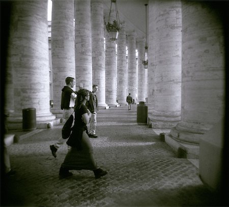 People on Walkway through Columns Vatican City, Rome, Italy Stock Photo - Rights-Managed, Code: 700-00075157