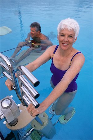 simsearch:700-00088915,k - Mature Couple in Swimwear Exercising in Swimming Pool Stock Photo - Rights-Managed, Code: 700-00075430