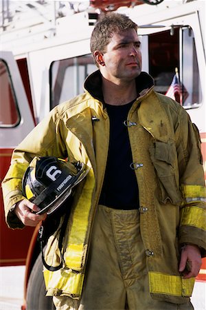 simsearch:700-00076137,k - Male Firefighter Holding Helmet Outdoors Foto de stock - Direito Controlado, Número: 700-00075544
