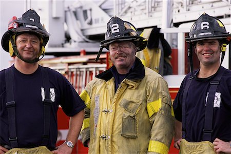 simsearch:700-00076137,k - Portrait of Three Male Firefighters Standing near Fire Engine Foto de stock - Direito Controlado, Número: 700-00075549