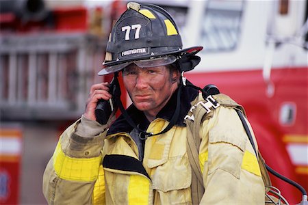 simsearch:700-00076137,k - Portrait of Male Firefighter Holding Walkie-Talkie Outdoors Foto de stock - Direito Controlado, Número: 700-00075540