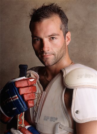 Portrait of Man Wearing Hockey Equipment Foto de stock - Direito Controlado, Número: 700-00076314