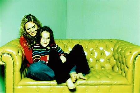 Portrait of Mother and Daughter Sitting on Sofa Stock Photo - Rights-Managed, Code: 700-00076329