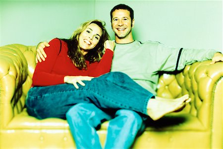 Portrait of Couple Sitting on Sofa Stock Photo - Rights-Managed, Code: 700-00076330