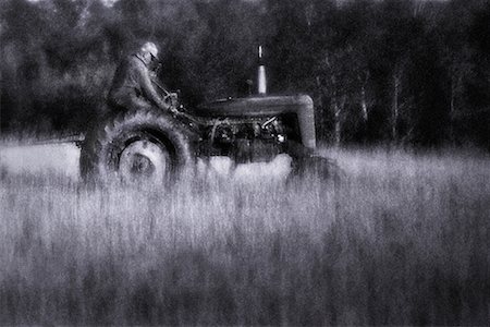 farm picture tractor black and white - Blurred View of Farmer on Tractor In Field Stock Photo - Rights-Managed, Code: 700-00076425