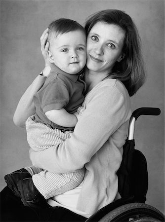 special needs child - Portrait of Mother in Wheelchair With Child Stock Photo - Rights-Managed, Code: 700-00076704