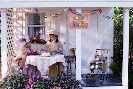 Two Girls Having Tea Party on Patio Stock Photo - Rights-Managed, Code: 700-00076839