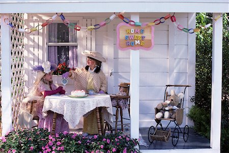 Two Girls Having Tea Party on Patio Stock Photo - Rights-Managed, Code: 700-00076840
