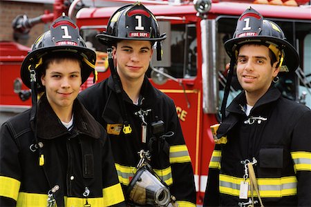 Portrait of Male Firefighters With Junior Firefighter Outdoors Stock Photo - Rights-Managed, Code: 700-00076896