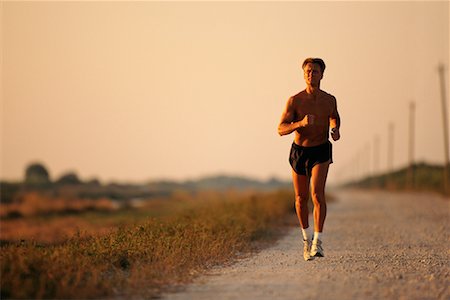 simsearch:700-00634176,k - Man Jogging on Dirt Road Stock Photo - Rights-Managed, Code: 700-00077218