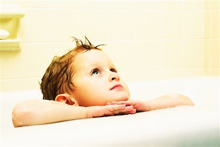 Boy Leaning on Edge of Bathtub Stock Photo - Rights-Managed, Code: 700-00077309