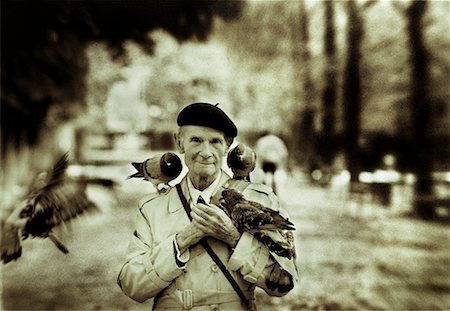 paris sepia - Portrait of Mature Man with Birds Outdoors Paris, France Stock Photo - Rights-Managed, Code: 700-00077442