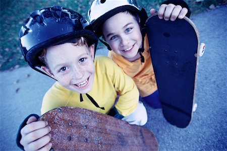Portrait of Two Boys with Skateboards Outdoors Foto de stock - Con derechos protegidos, Código: 700-00077537