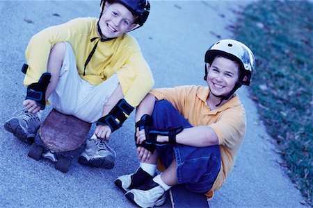 portrait of boy sitting on skateboard - Portrait of Two Boys with Skateboards Outdoors Stock Photo - Rights-Managed, Code: 700-00077538