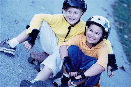 portrait of boy sitting on skateboard - Portrait of Two Boys with Skateboards Outdoors Stock Photo - Rights-Managed, Code: 700-00077539