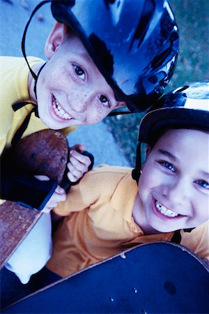 Portrait of Two Boys with Skateboards Outdoors Foto de stock - Con derechos protegidos, Código: 700-00077540