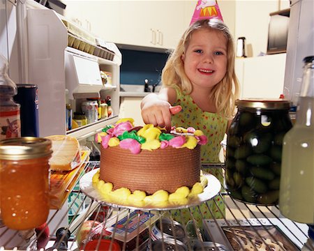 Portrait of Girl Eating Cake from Fridge Stock Photo - Rights-Managed, Code: 700-00077715