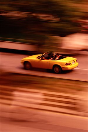 simsearch:700-00069624,k - Blurred View of Convertible in Traffic Foto de stock - Con derechos protegidos, Código: 700-00077732