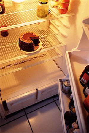 simsearch:700-00077839,k - Sparsely Stocked Fridge with Chocolate Cake Stock Photo - Rights-Managed, Code: 700-00077840