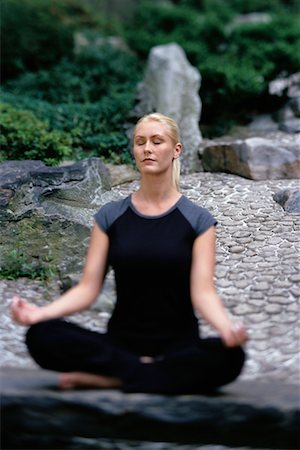 Woman Sitting in Lotus Position Outdoors Stock Photo - Rights-Managed, Code: 700-00077889