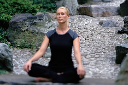 Woman Sitting in Lotus Position Outdoors Stock Photo - Rights-Managed, Code: 700-00077890