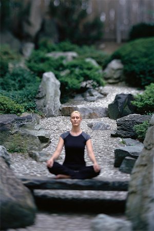 Woman Sitting in Lotus Position Outdoors Stock Photo - Rights-Managed, Code: 700-00077891