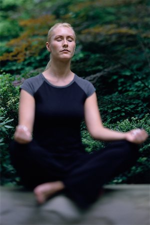 Woman Sitting in Lotus Position Outdoors Stock Photo - Rights-Managed, Code: 700-00077892