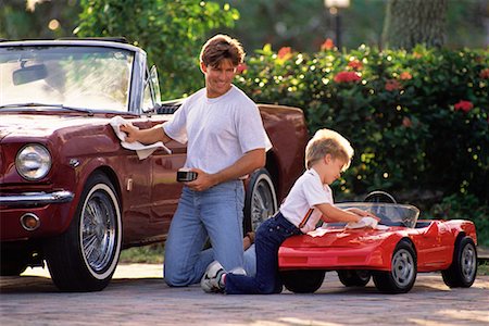 funny convertible car image - Father Polishing Car with Son Polishing Toy Car Stock Photo - Rights-Managed, Code: 700-00078275