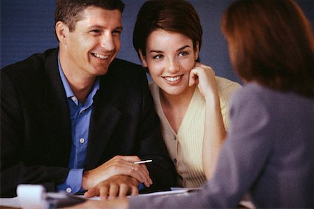 financial advisor talking to couple - Couple in Meeting with Businesswoman Stock Photo - Rights-Managed, Code: 700-00078422