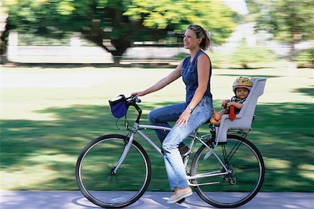 Mother Riding Bike in Park with Child Stock Photo - Rights-Managed, Code: 700-00078648